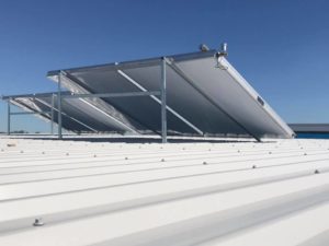 Solar hot water system panels installed on a metal roof in Bribie Island