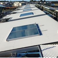Rooftop solar hot water systems installed on a large building in Bribie Island