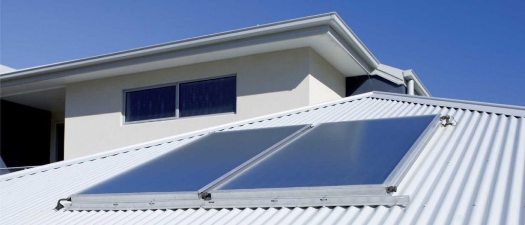 Solar hot water systems on a corrugated roof in Bribie Island, sunny day